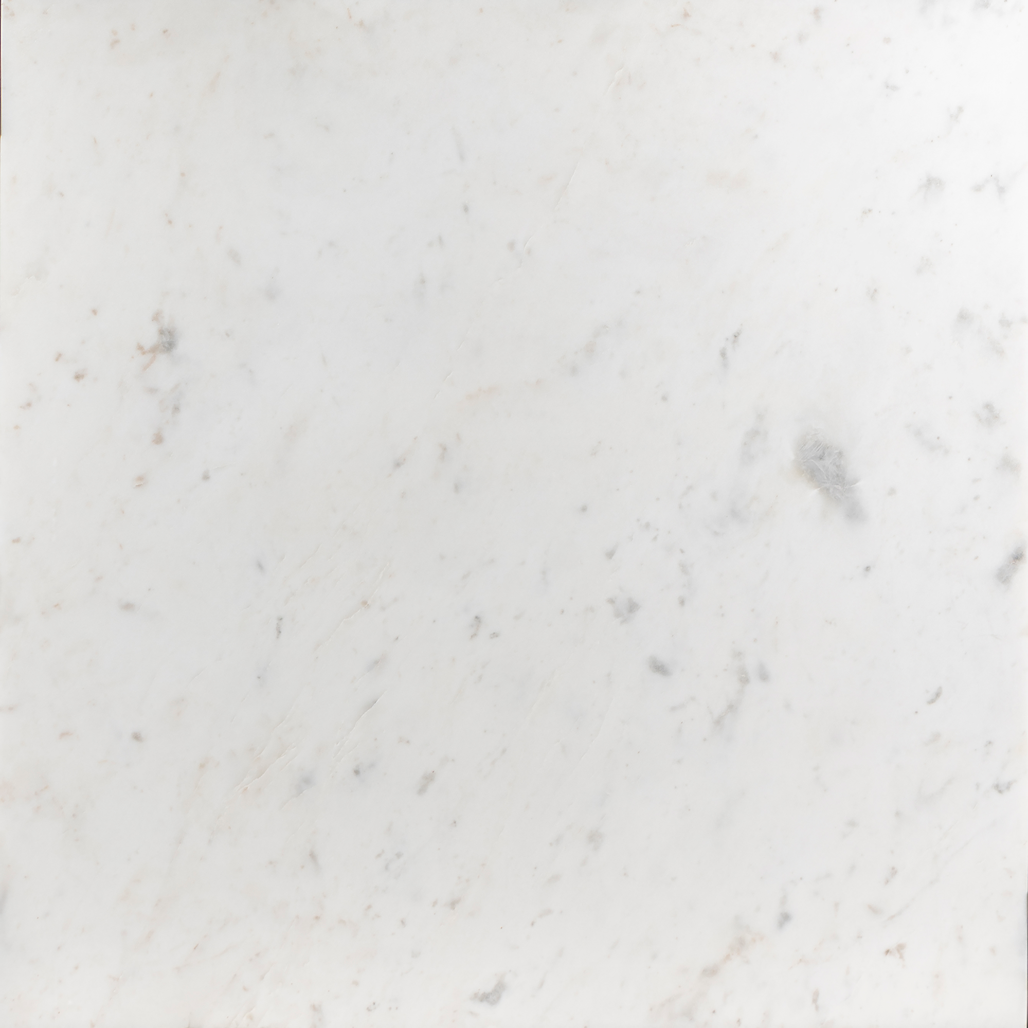 Texture close-up of white marble coffee table surface with faint veining